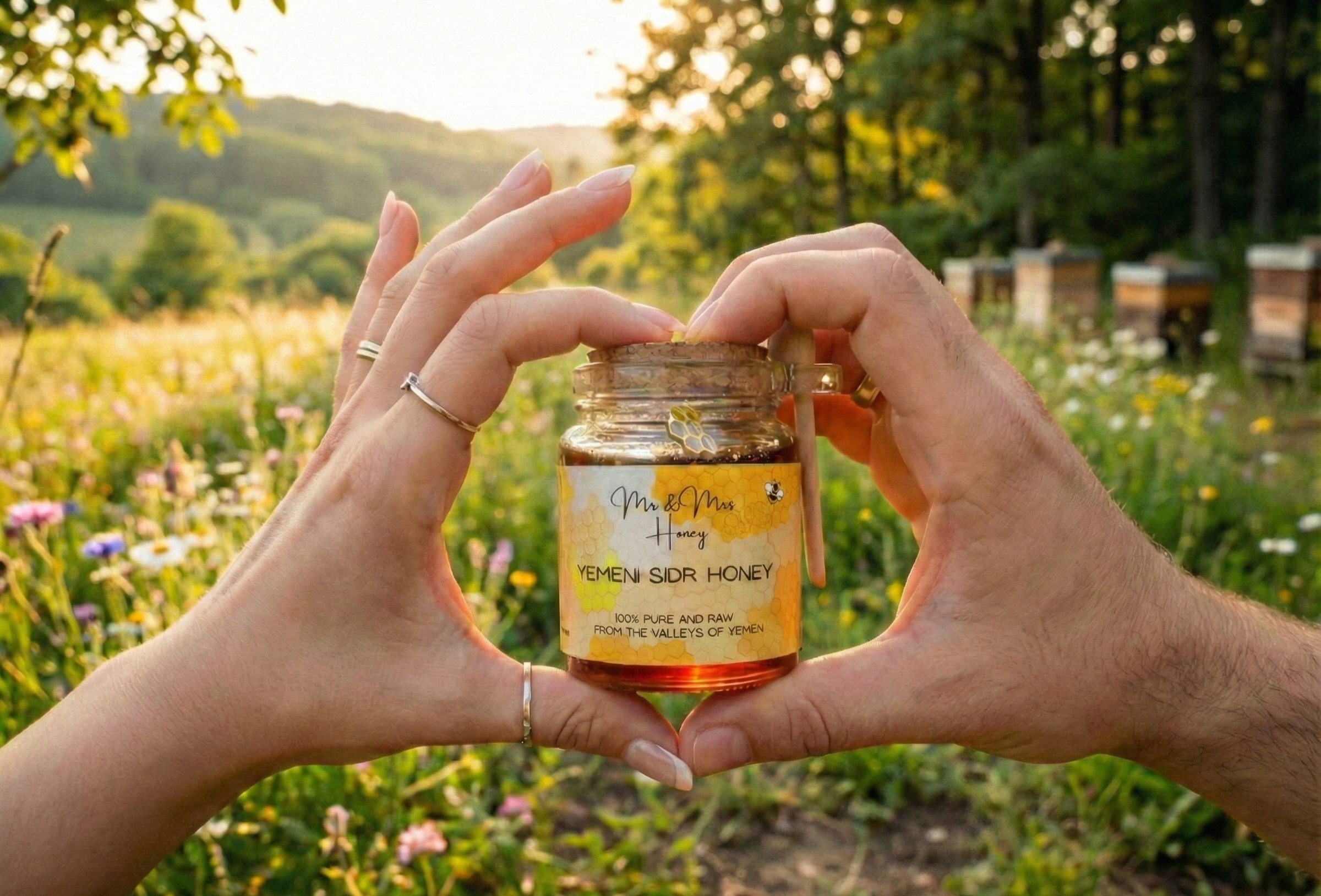 Hands holding Mr & Mrs Honey jar in garden